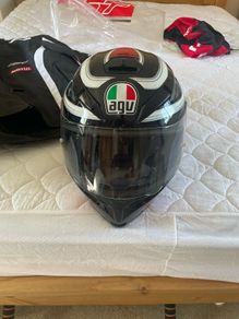 Harley Davidson leather jacket bought in the u.sa brand new never worn. Also agv helmet new also