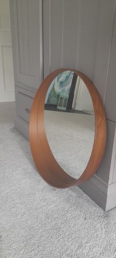Round mirror with wooden frame