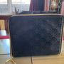 Estee Lauder Vanity case in black with applique style design in the front and a nice bow style handle on top