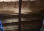 tall wooden display stand on four legs