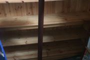 tall wooden display stand on four legs
