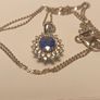 Natural Oval Sapphire, Zircon & Blue Appetite Halo Cluster Pendant Image 6
