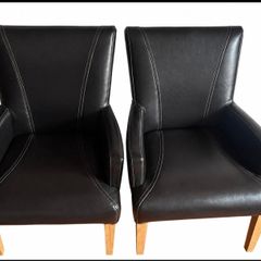 two leather carver chairs