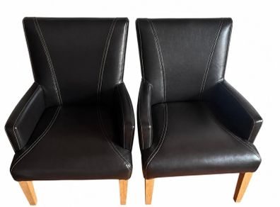 two leather carver chairs