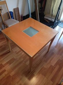 Square glass topped dining table