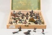 Antique stamped lead toys in carrier box