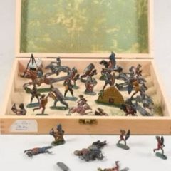 Antique stamped lead toys in carrier box