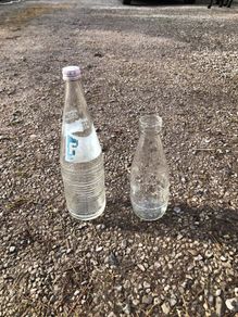 2 glass bottles. Fanta and milk