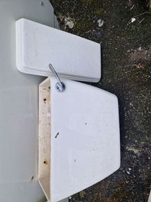Used ceramic toilet cistern tank