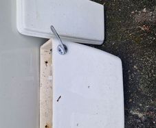 Used ceramic toilet cistern tank