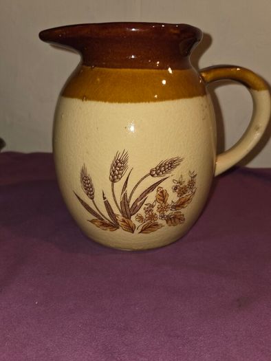 Vintage brown and tan water jug with wheat design