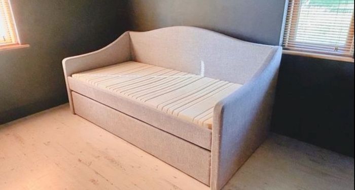 Light grey  upholstered daybed with under-bed storage drawer