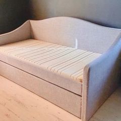 Light grey  upholstered daybed with under-bed storage drawer