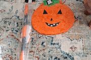 Halloween pumpkin Pinata with stick and mask.