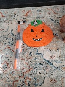 Halloween pumpkin Pinata with stick and mask.