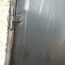 Garage door with double door. solid tick iron pan. has inlock and bolt locks. can be divided into two single doors and use separate with one door each. Size 7.5 x7.5 feet.. Image 3