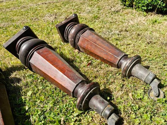 Antique mahogany piano legs with bronze casters