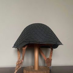 Original Cold War East German M56/76 Stahlhelm with camouflage net. NVA. Complete. Militaria