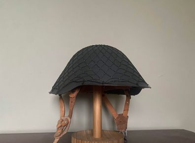 Original Cold War East German M56/76 Stahlhelm with camouflage net. NVA. Complete. Militaria