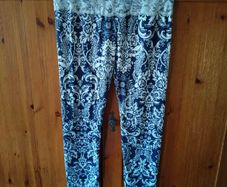 blue and white leggings with damask print with a white lace waistband. New never worn.