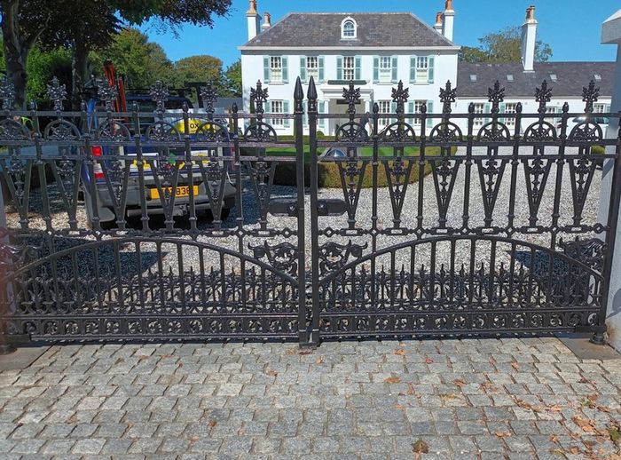 Set of brand new solid cast iron gates with posts