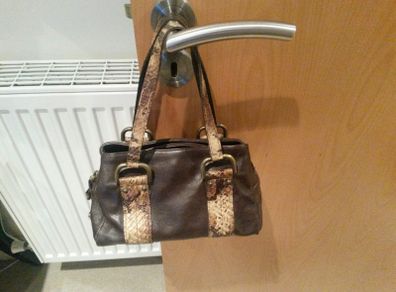Small chocolate brown handheld bag