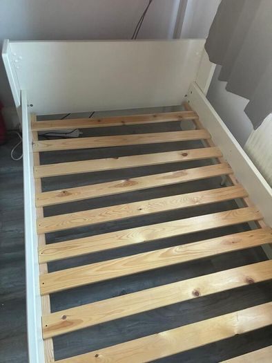 White single bed frame with wooden slats