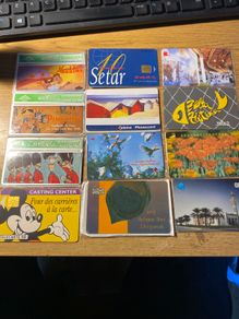 Collection of 12 vintage international phonecards