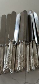 Set of 12 vintage Mappin & Webb stainless steel table knives from a family estate collection.