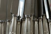 Set of 12 vintage Mappin &amp; Webb stainless steel table knives from a family estate collection.