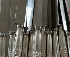 Set of 12 vintage Mappin & Webb stainless steel table knives from a family estate collection.