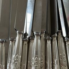 Set of 12 vintage Mappin & Webb stainless steel table knives from a family estate collection.