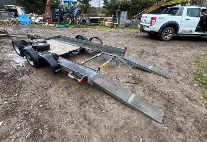 bryan james car carrying trailer Brian