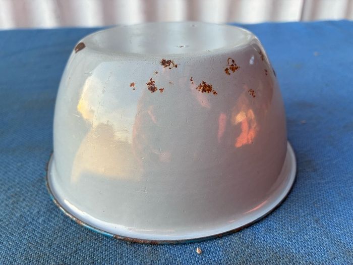 Vintage grey enamel dish with blue rim
