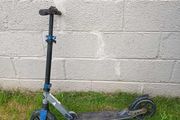 Blue folding kick scooter
