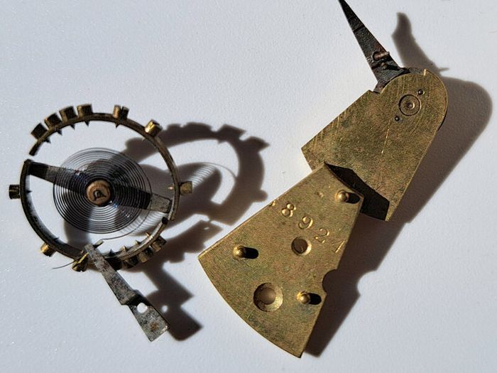 Lot of Antique Watch Parts in Containers