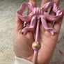 Large 13cm high x 10cm width metal bow hook in bubblegum pink with gold detail Image 8