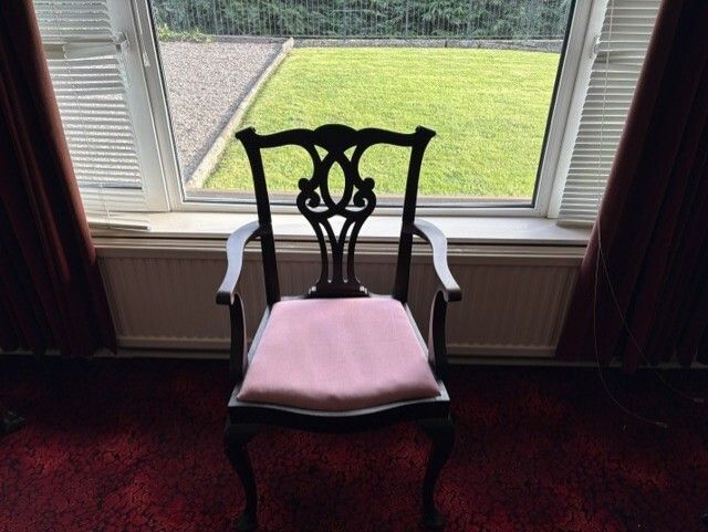 Traditional mahogany carver chair with pink upholstered seat