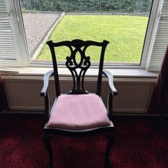 Traditional mahogany carver chair with pink upholstered seat