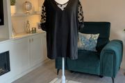 Ladies Black Short-sleeve Top Features Sheer polka-dot mesh sleeves