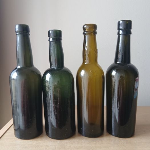 Lot of 4 vintage Guinness bottles