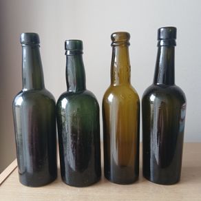 Lot of 4 vintage Guinness bottles