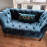 2 sofas, 1 grey and 1 teal. Image 2