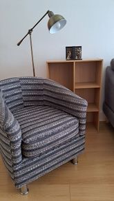 Tub chair, floor light and bookcase