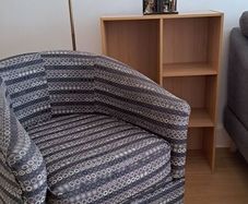 Tub chair, floor light and bookcase