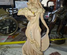 Beautiful Old Figurine distinctive Art Nouveau style of Italian sculptor, depicting an elegant woman in a flowing pastel gown holding a floral arrangement, Postage Available or Collection