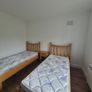 2x Solid Oak Single Beds incl mattress and bedside locker. Image 3