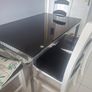 Black Glass Table And 4 Black And White Wooden Chairs Image 2