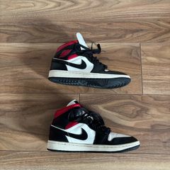Nike Air Jordan 1 Mid trainers in the classic black, white and red colourway