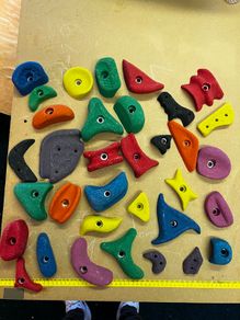 Climbing wall grips